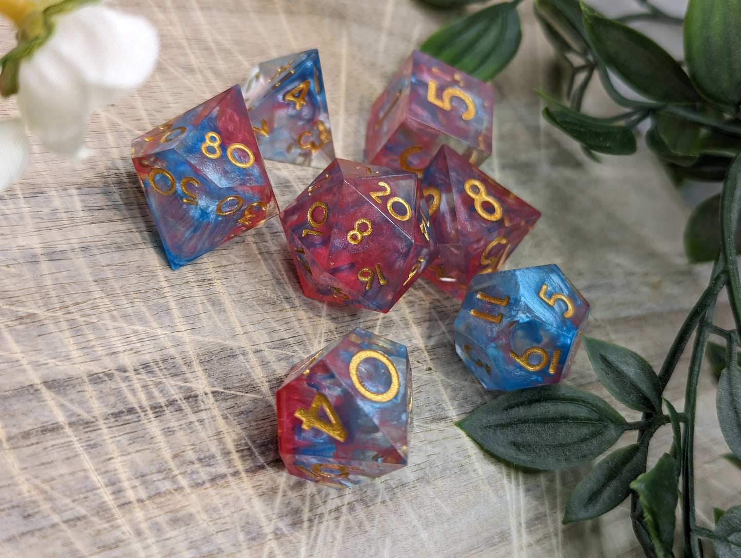 Pink, Blue and Gold Sharp Edge Dice Set Low Angle