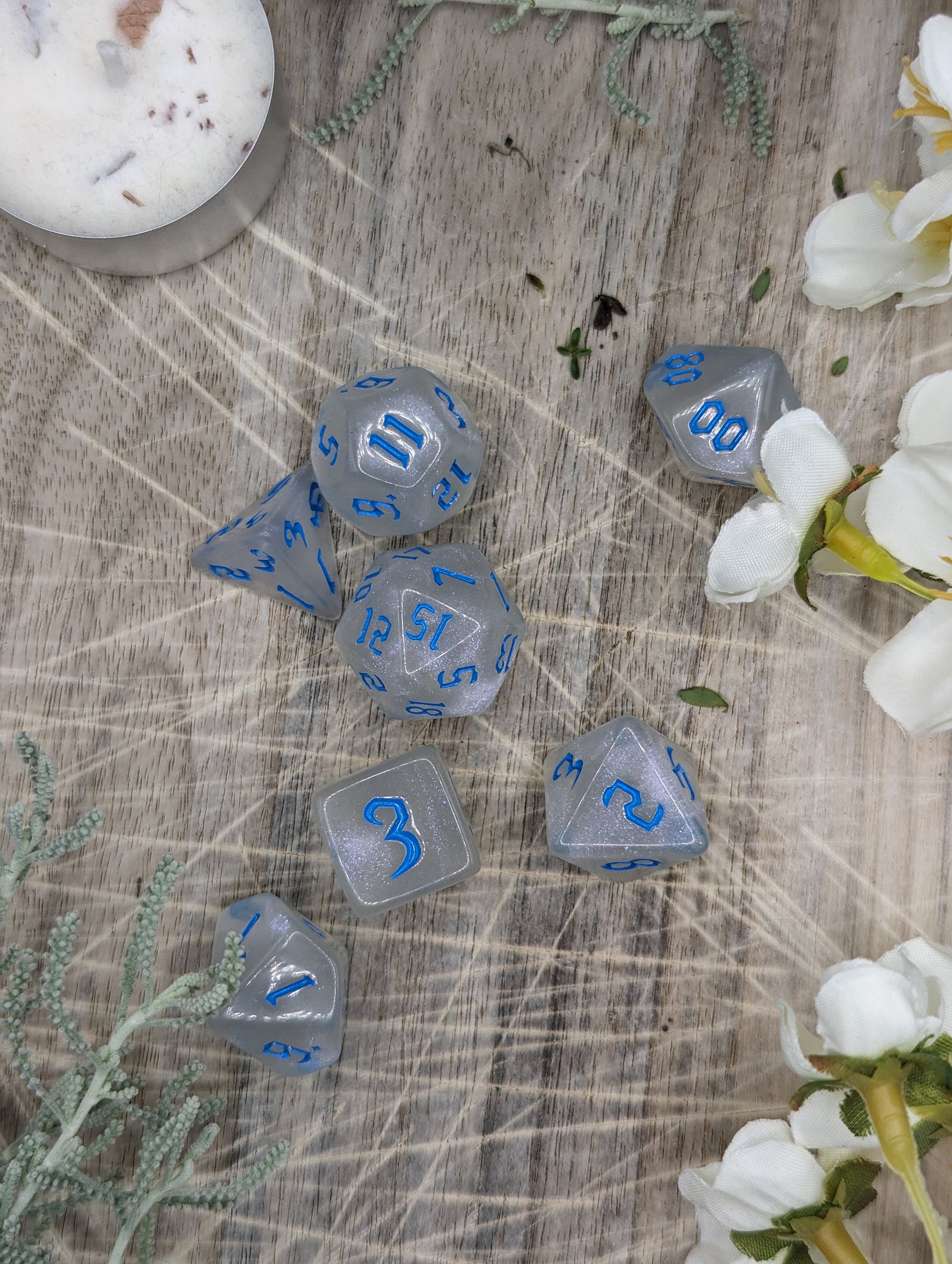 Blue and White Sparkle Polyhedral Dungeons and Dragons Dice Set Top Down Scattered